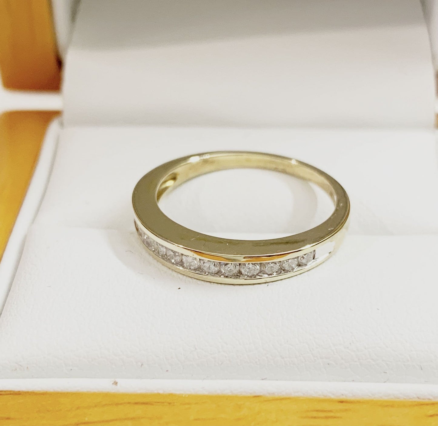 Yellow gold diamond eternity ring channel setting 25 points