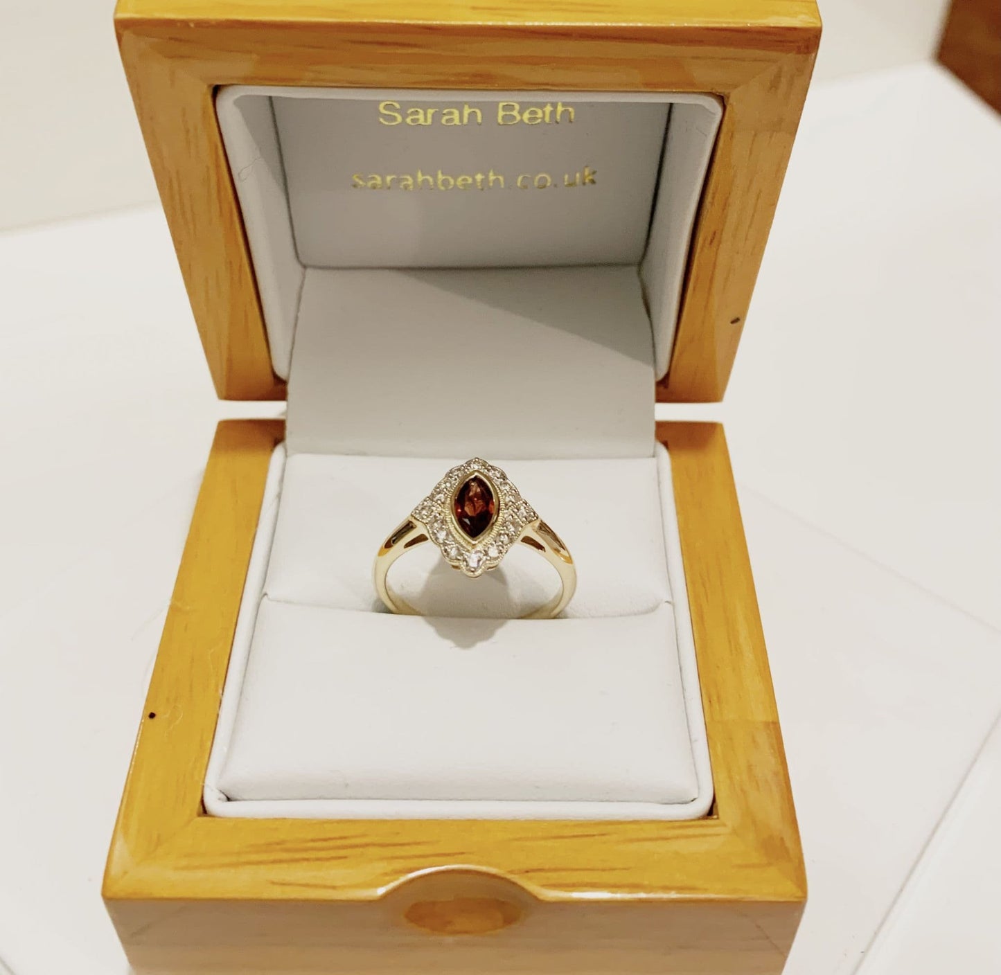 Yellow gold marquise garnet and diamond cluster ring