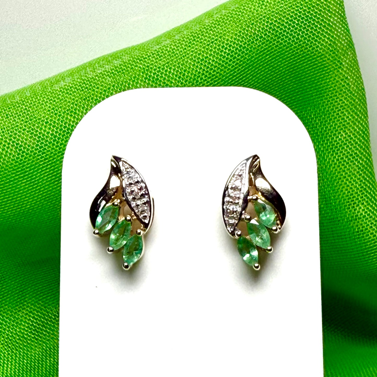 Green emerald and diamond stud earrings yellow gold