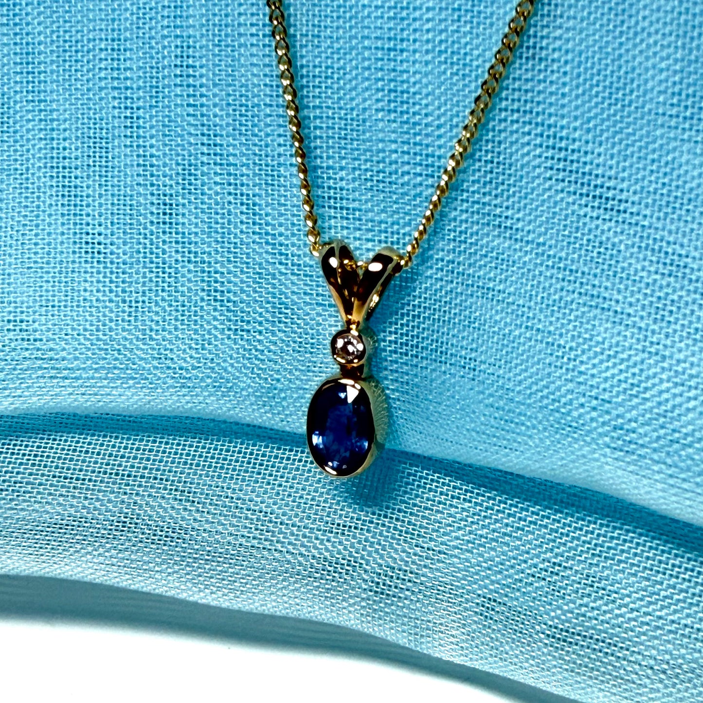 Yellow gold necklace real blue sapphire and diamond round and oval shaped pendant