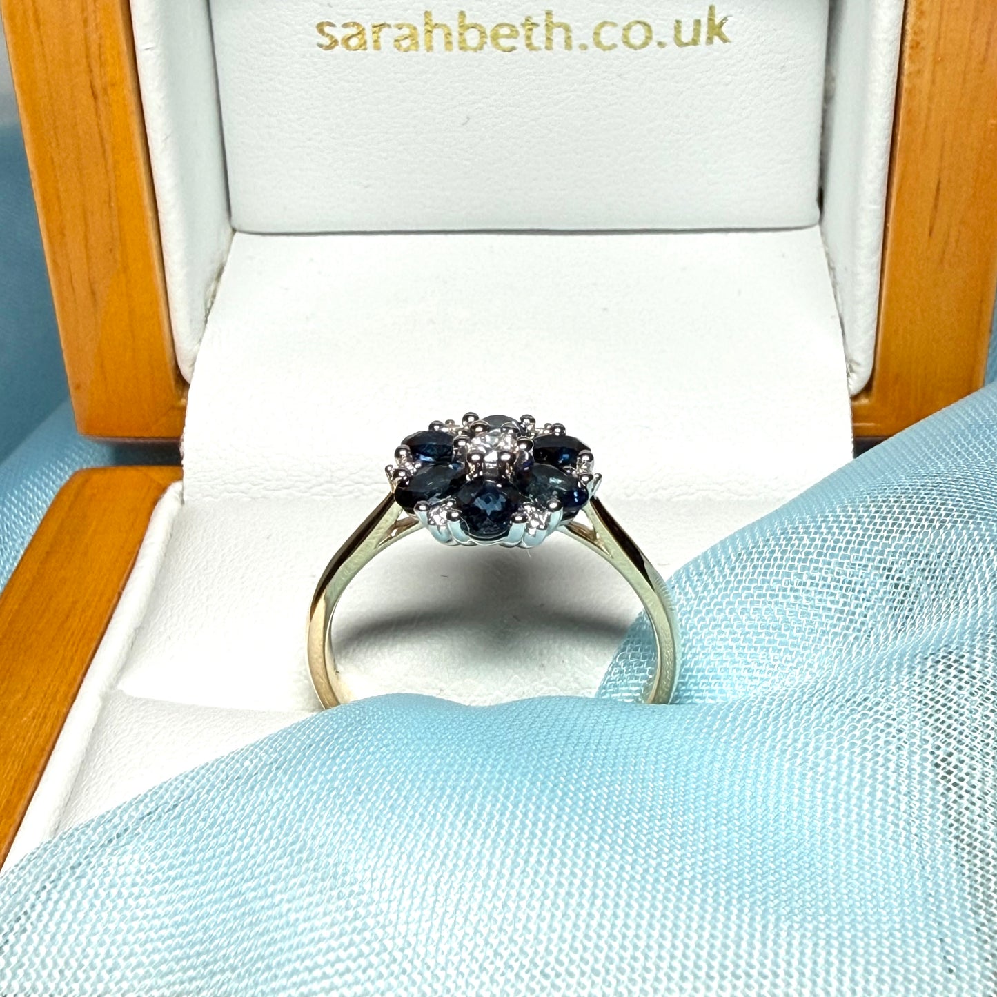 Yellow gold real dark blue sparkling sapphire and diamond round shaped cluster ring