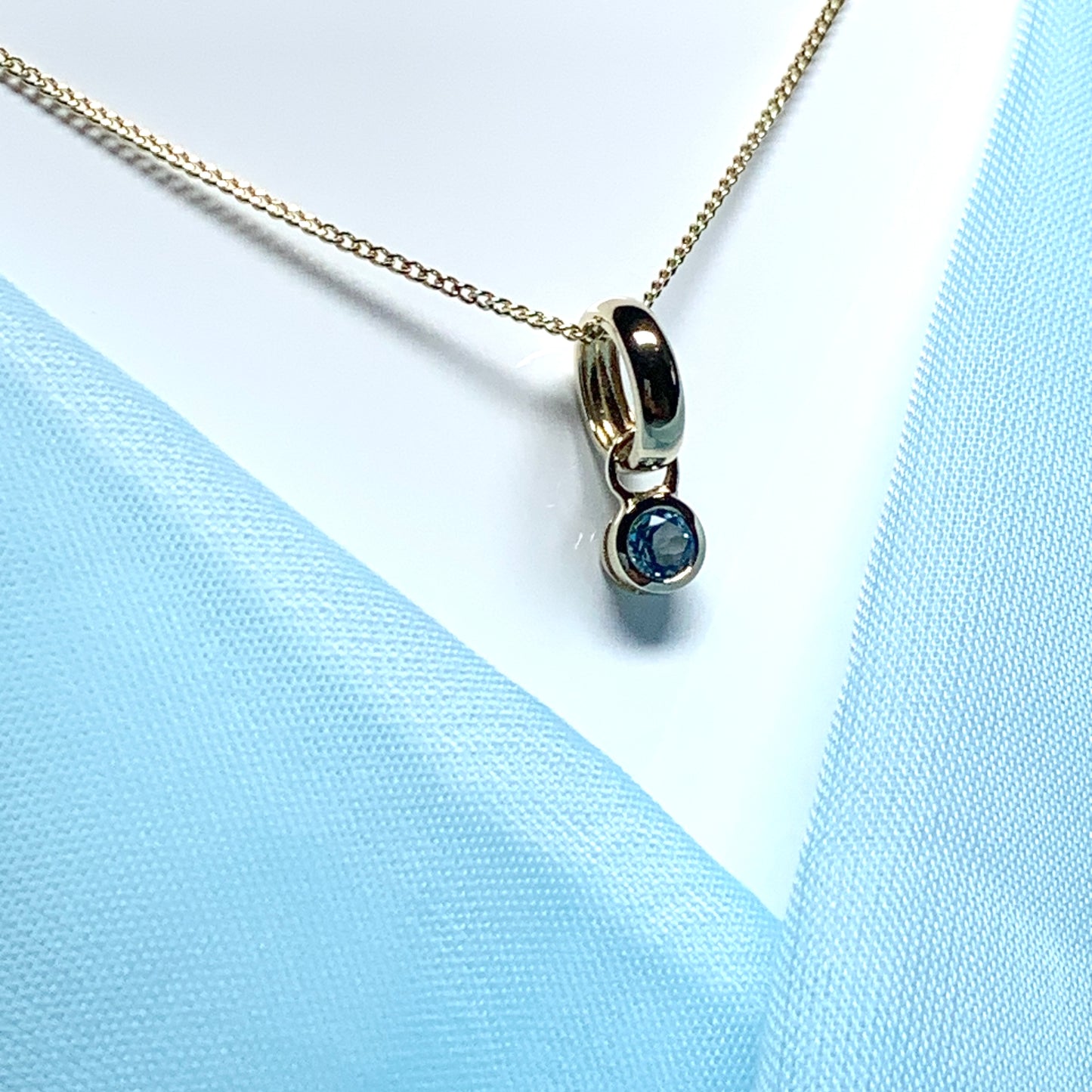 Yellow gold blue topaz circle drop necklace pendent