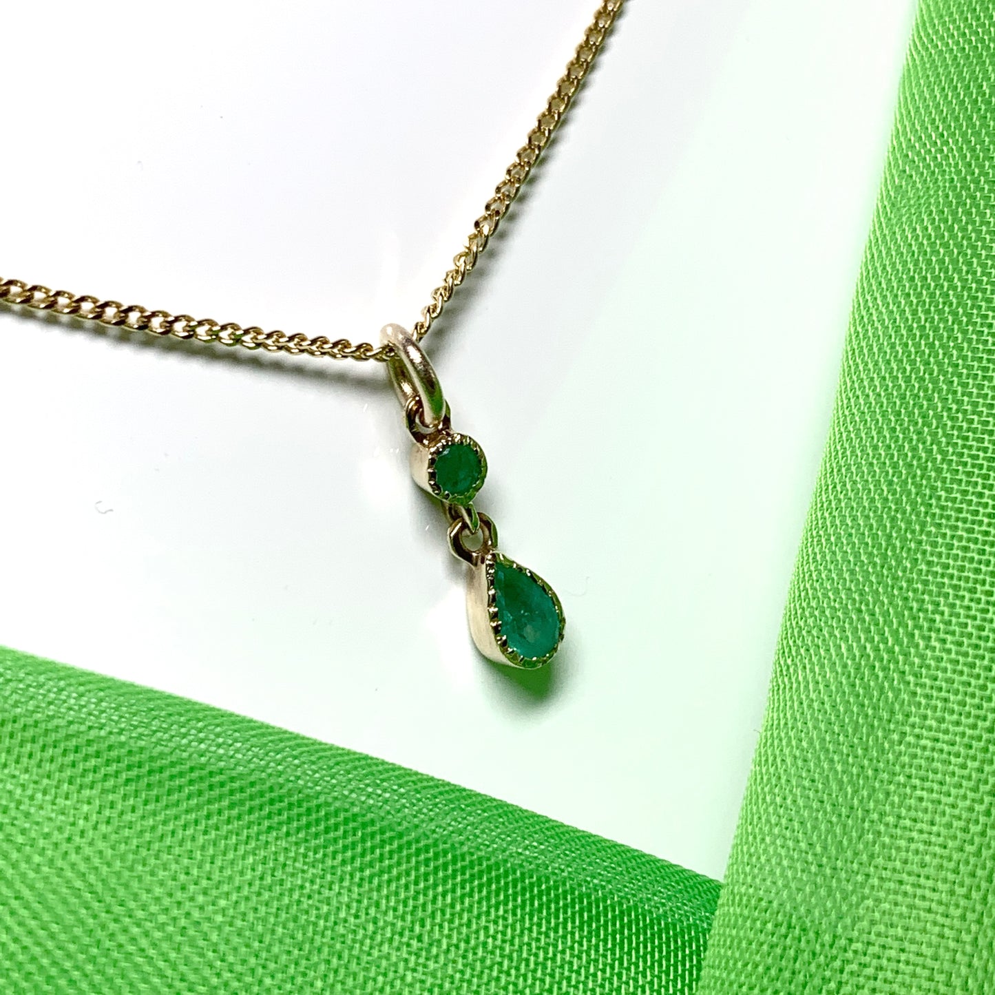 Yellow gold fancy emerald necklace