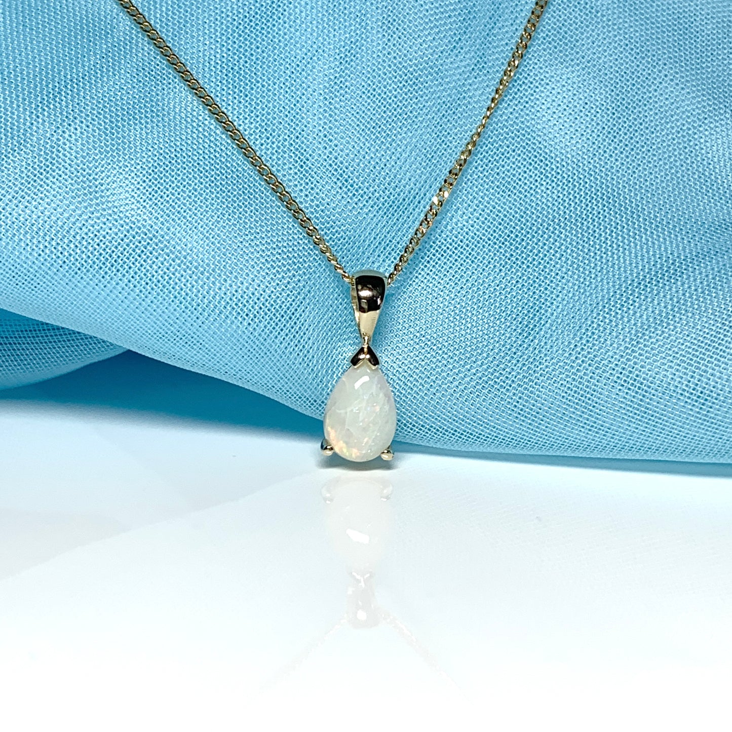 Opal yellow gold pear shaped necklace