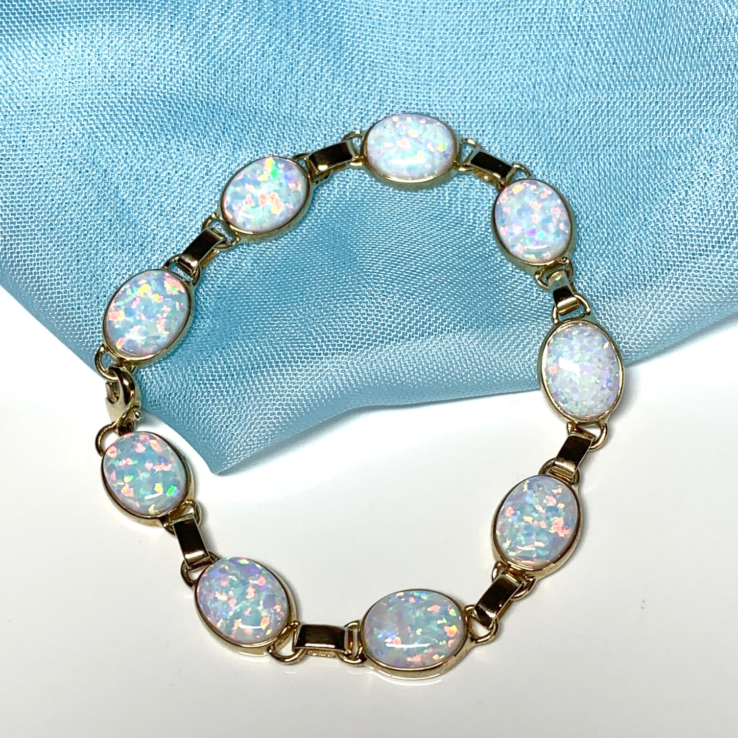 Yellow gold oval opal bracelet
