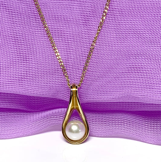 Yellow gold oval cultured pearl necklace swirl fancy