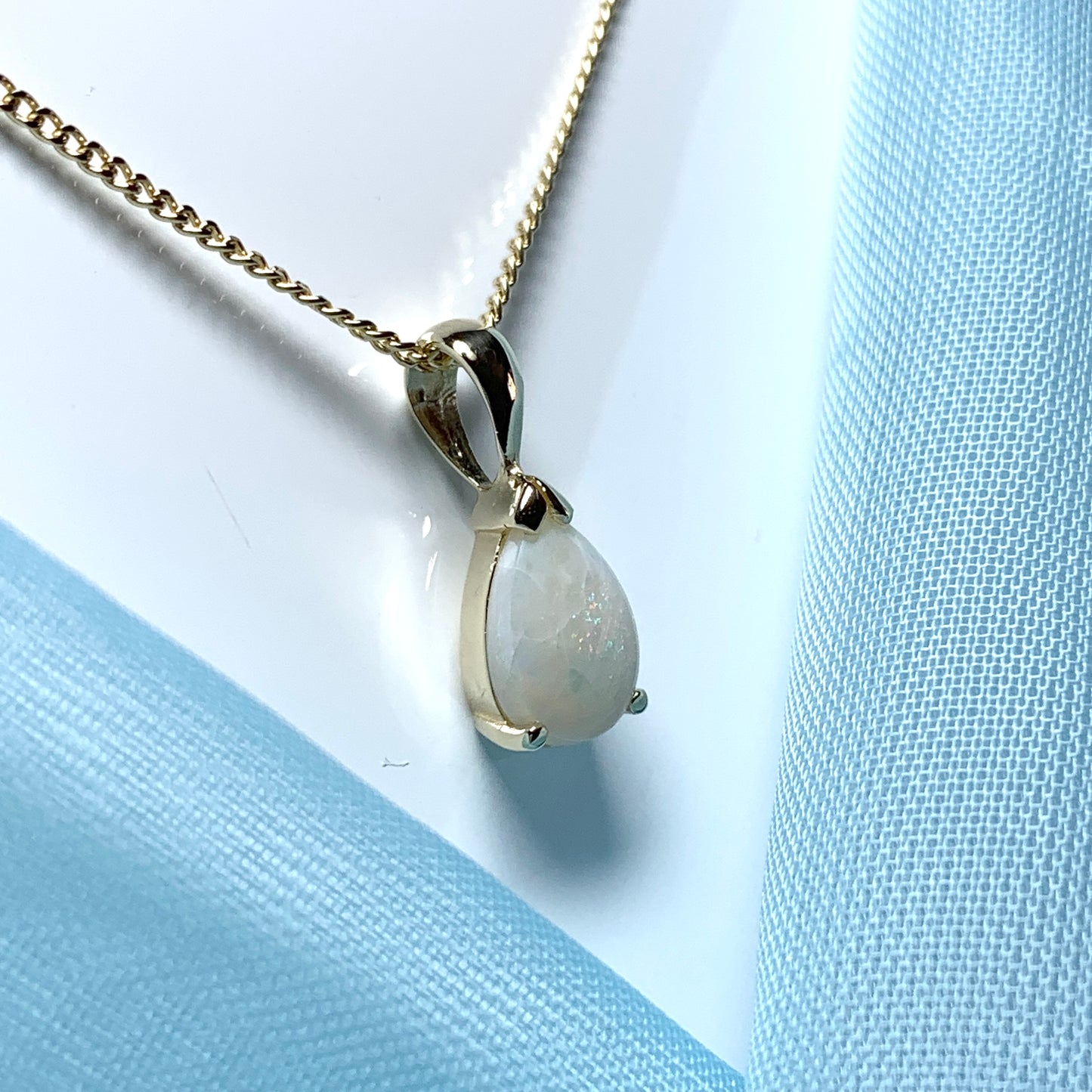 Opal yellow gold pear shaped necklace