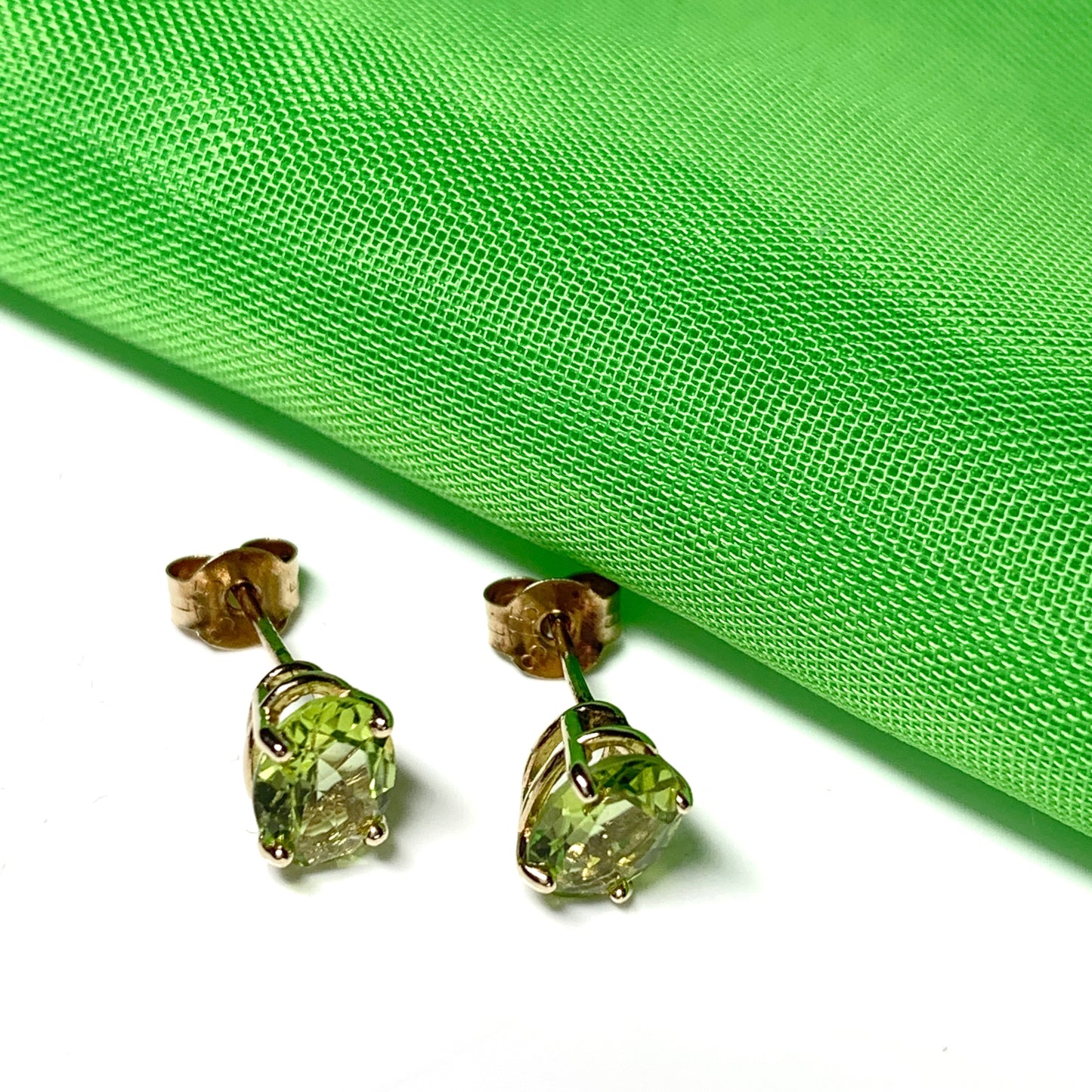 Yellow gold peridot oval stud earrings