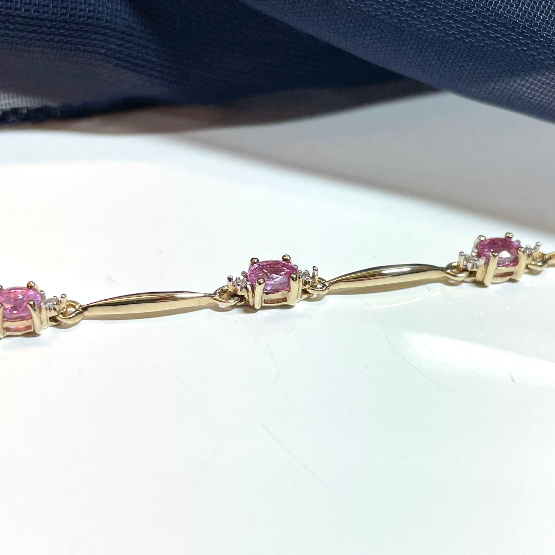 Pink sapphire and diamond yellow gold bracelet