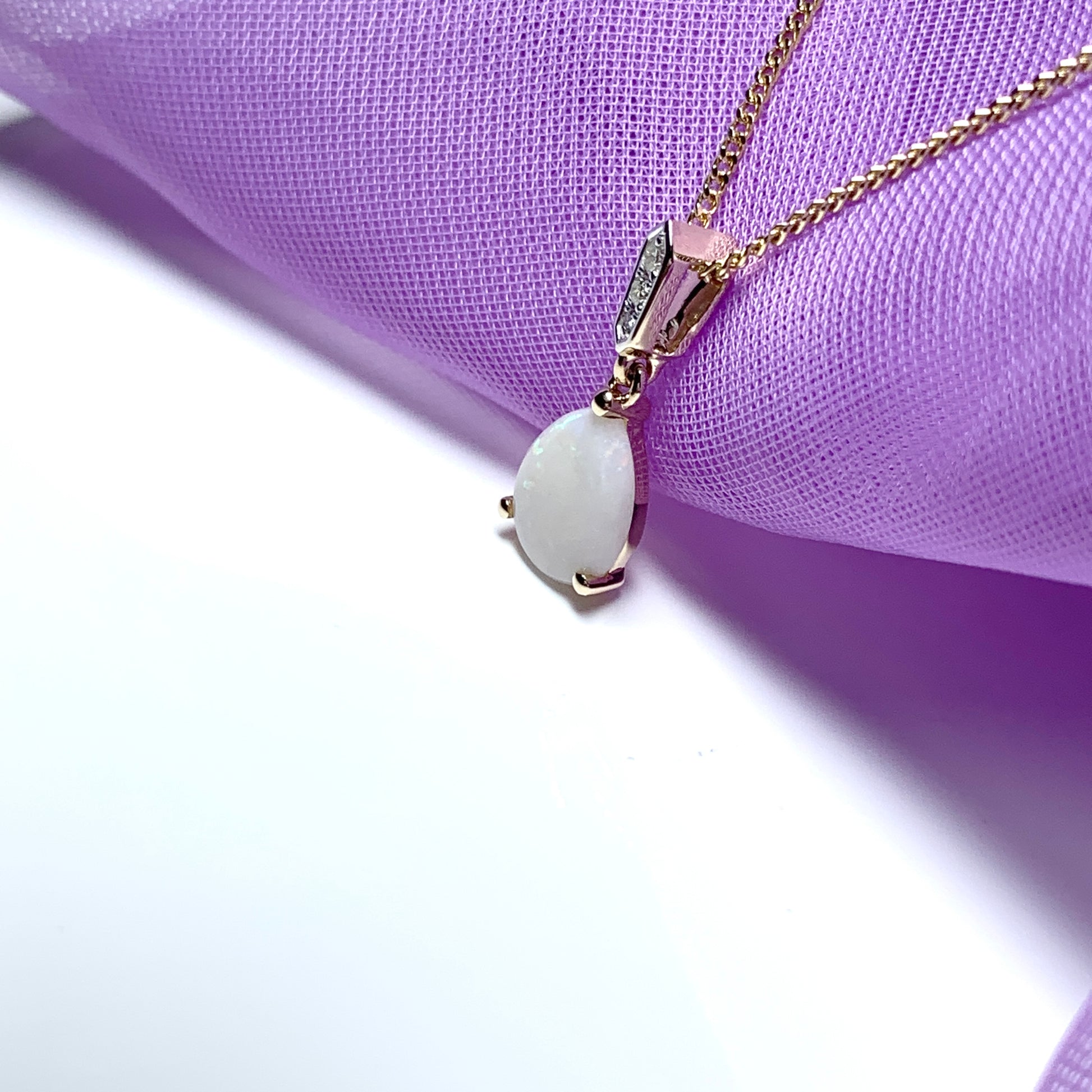 Yellow gold real opal and diamond pear shaped necklace
