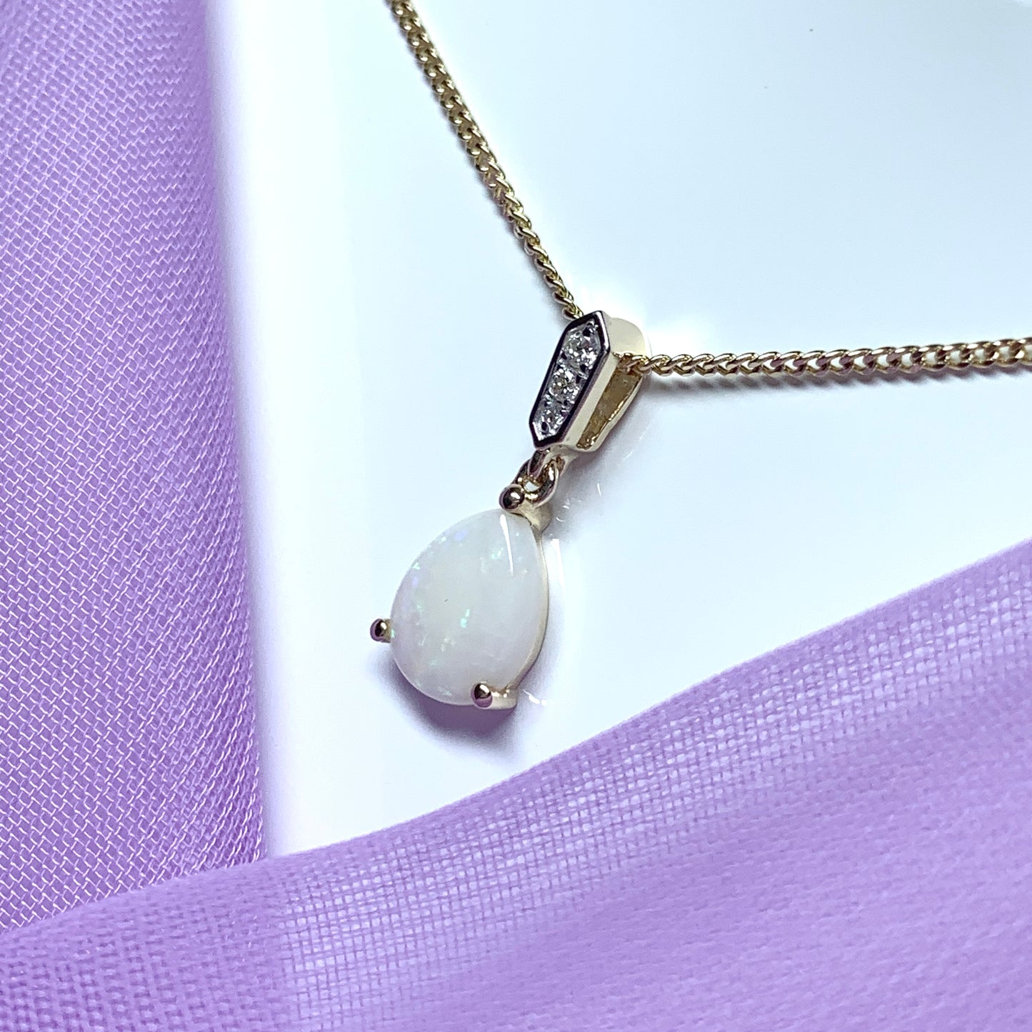 Yellow gold real opal and diamond pear shaped necklace