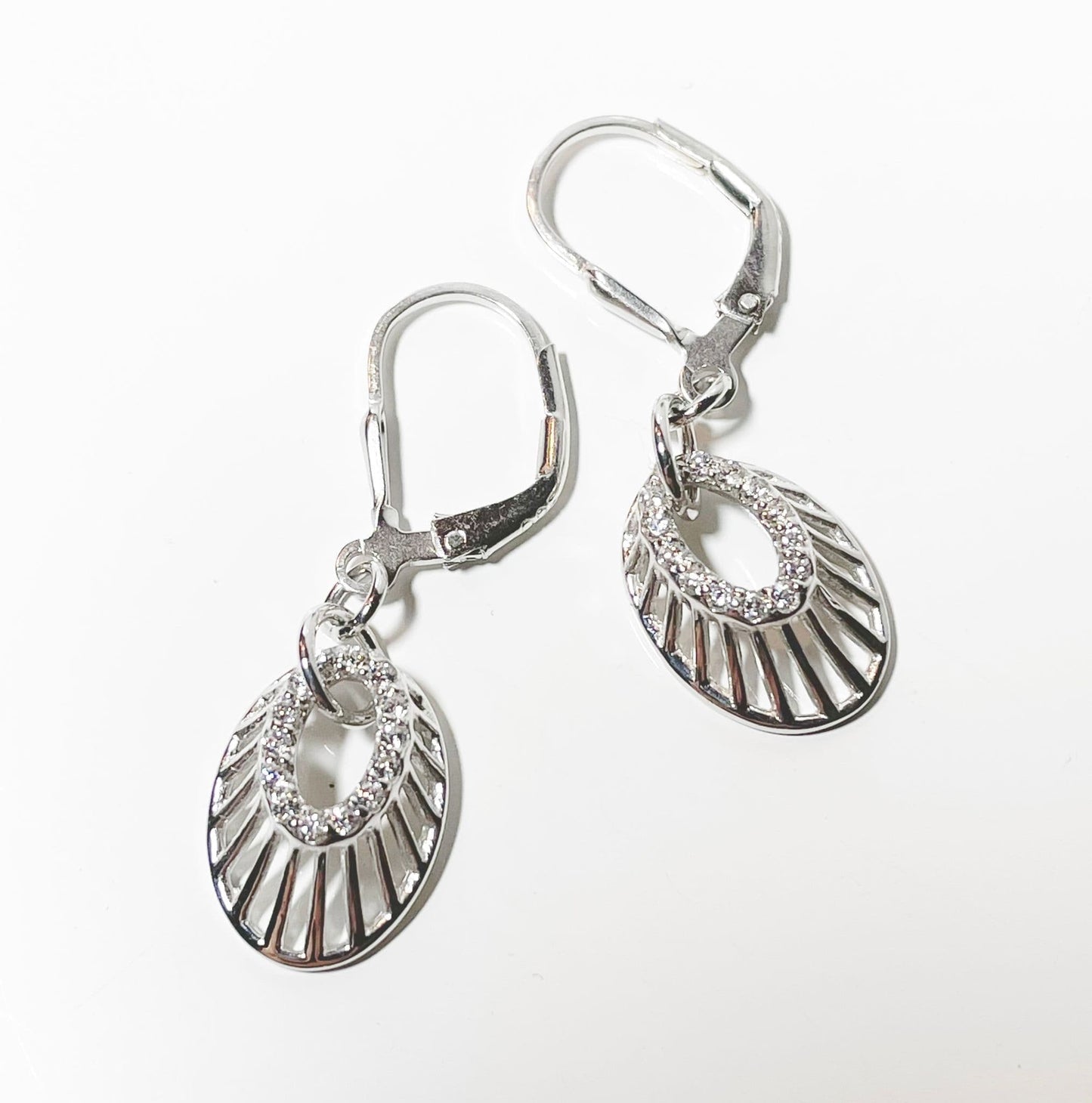 an Oval shaped cubic zirconia sterling silver drop earrings