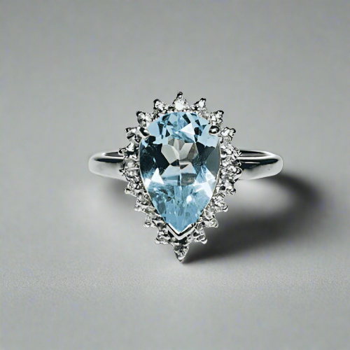Large pear shaped blue topaz and diamond sterling silver cluster ring