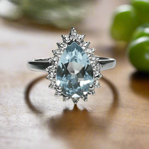 Large pear shaped blue topaz and diamond sterling silver cluster ring