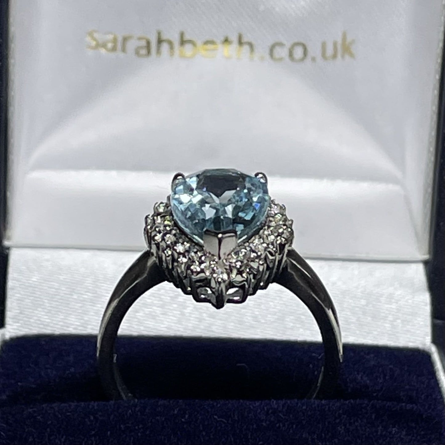 Large pear shaped blue topaz and diamond sterling silver cluster ring