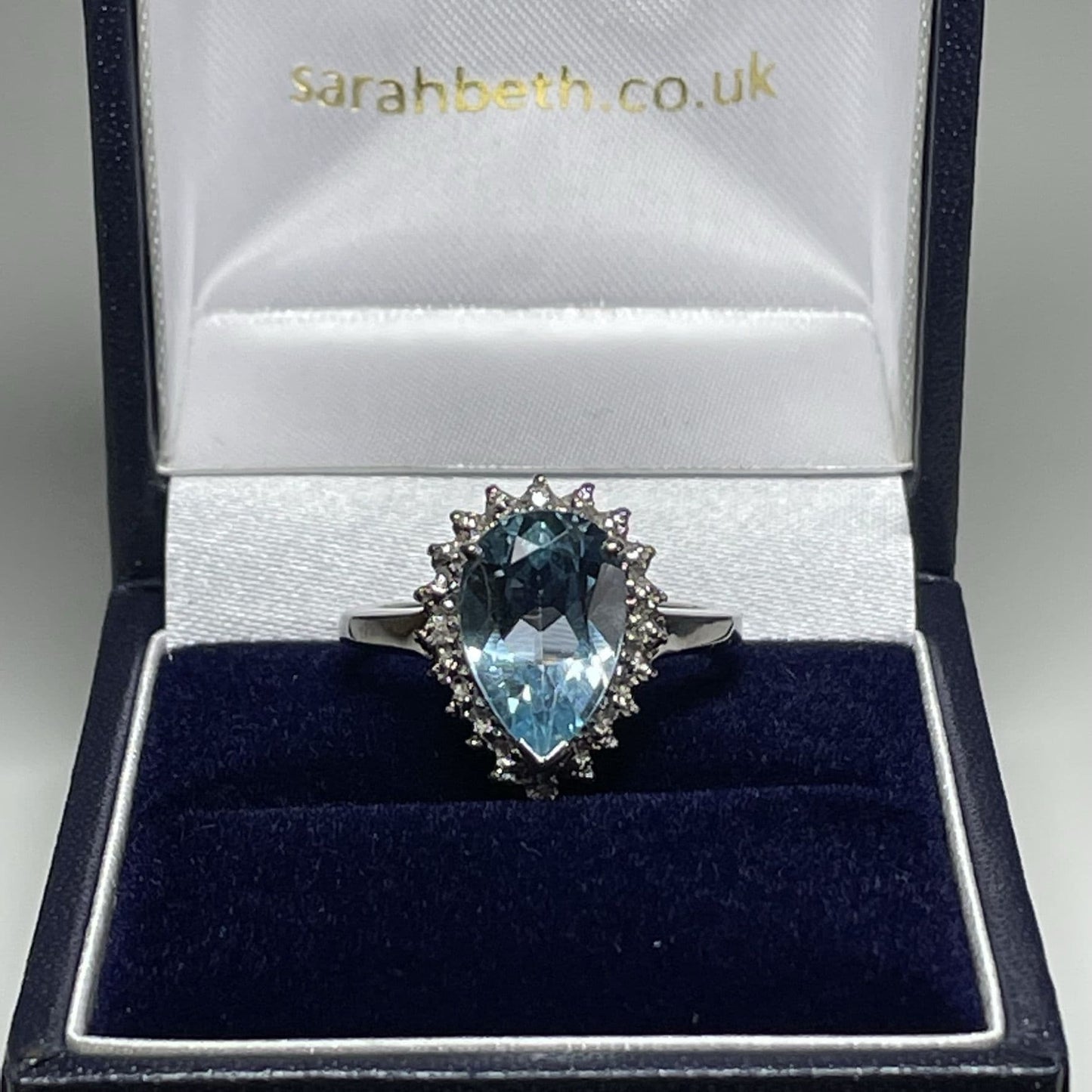 Large pear shaped blue topaz and diamond sterling silver cluster ring