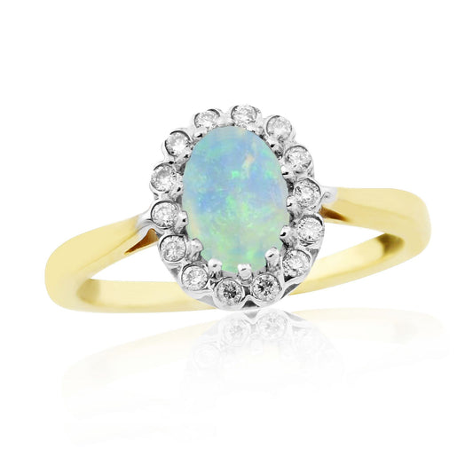 Oval real opal and diamond yellow gold cluster ring