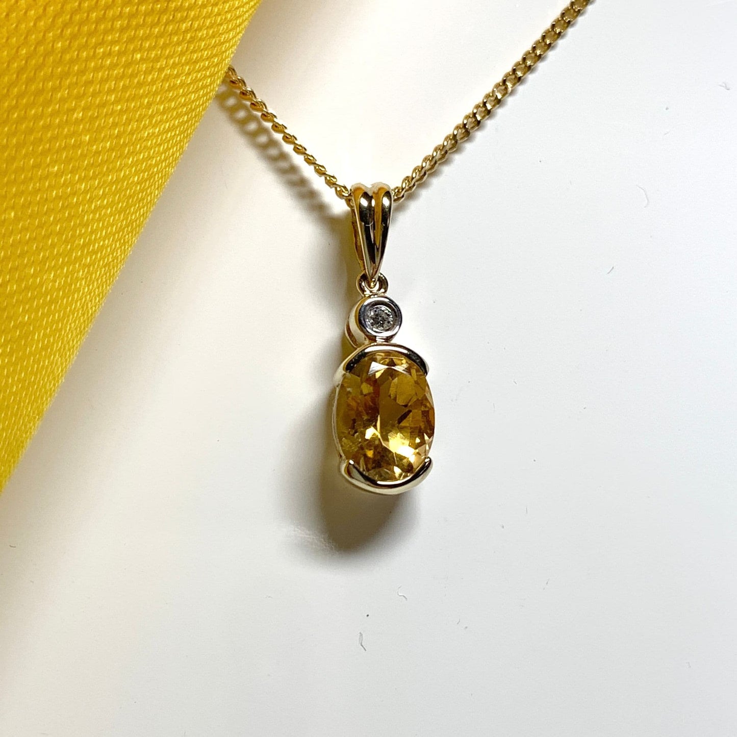 Oval yellow citrine and diamond gold necklace