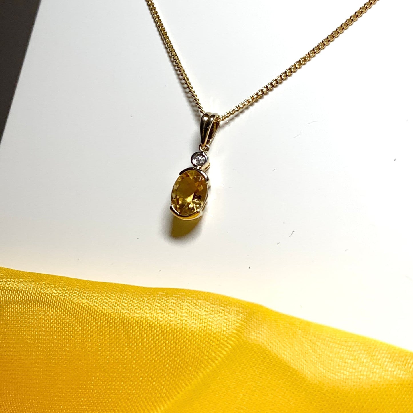 Oval yellow citrine and diamond gold necklace