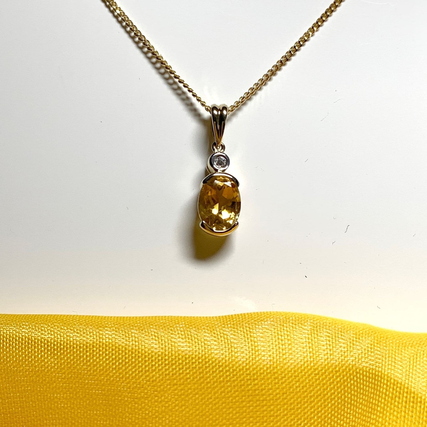 Oval yellow citrine and diamond gold necklace