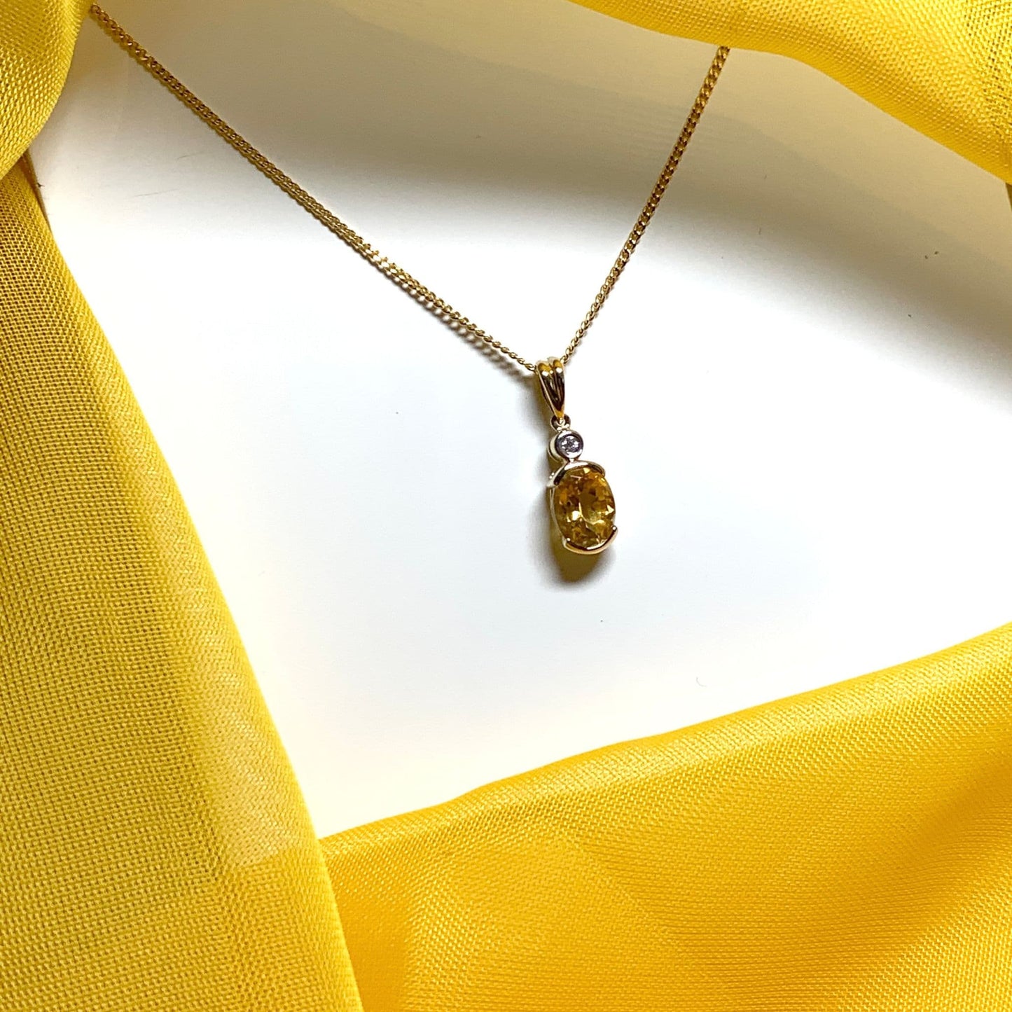 Oval yellow citrine and diamond gold necklace