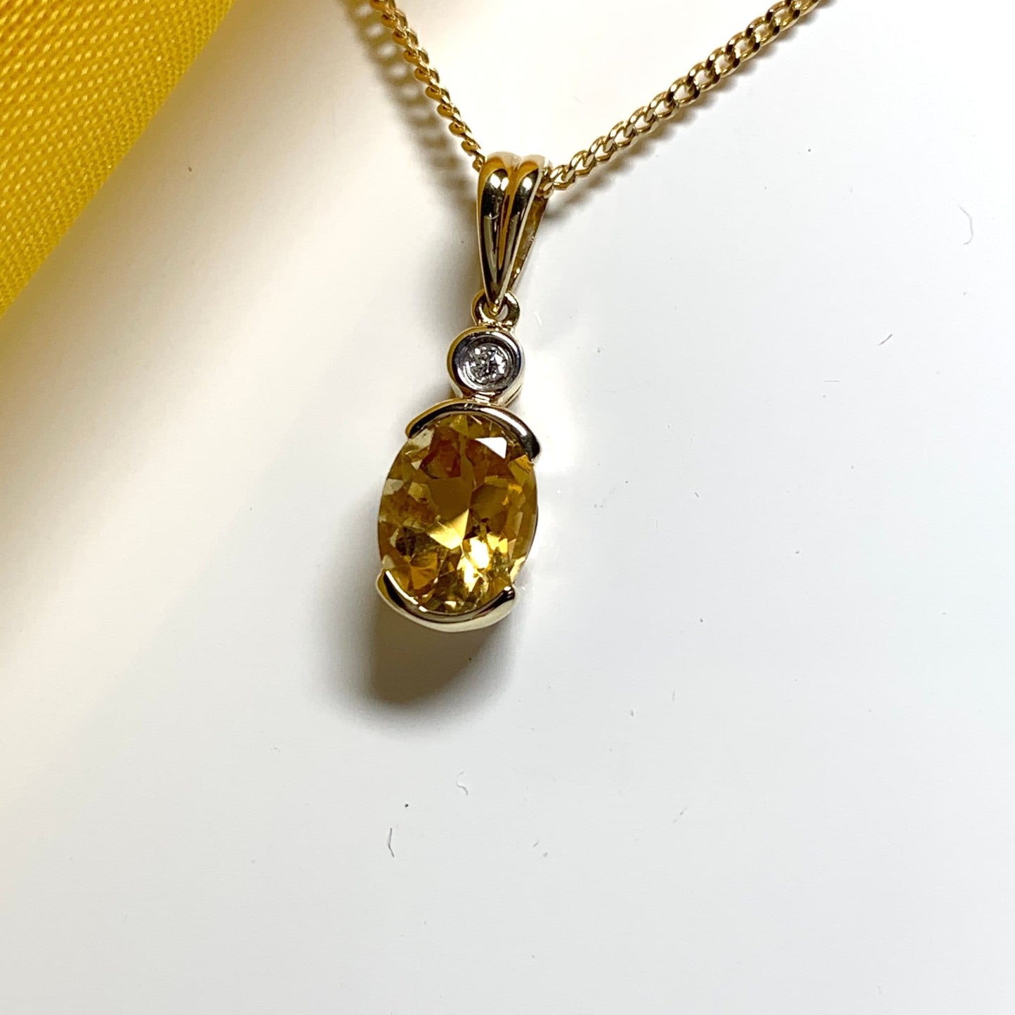 Oval yellow citrine and diamond gold necklace