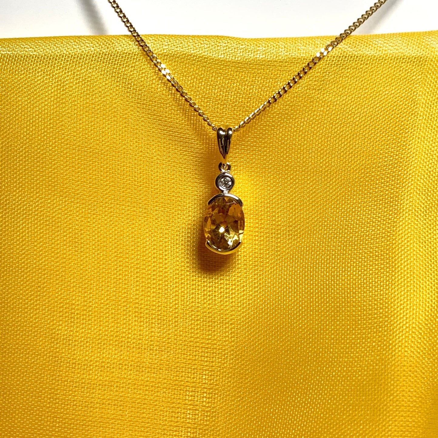 Oval yellow citrine and diamond gold necklace