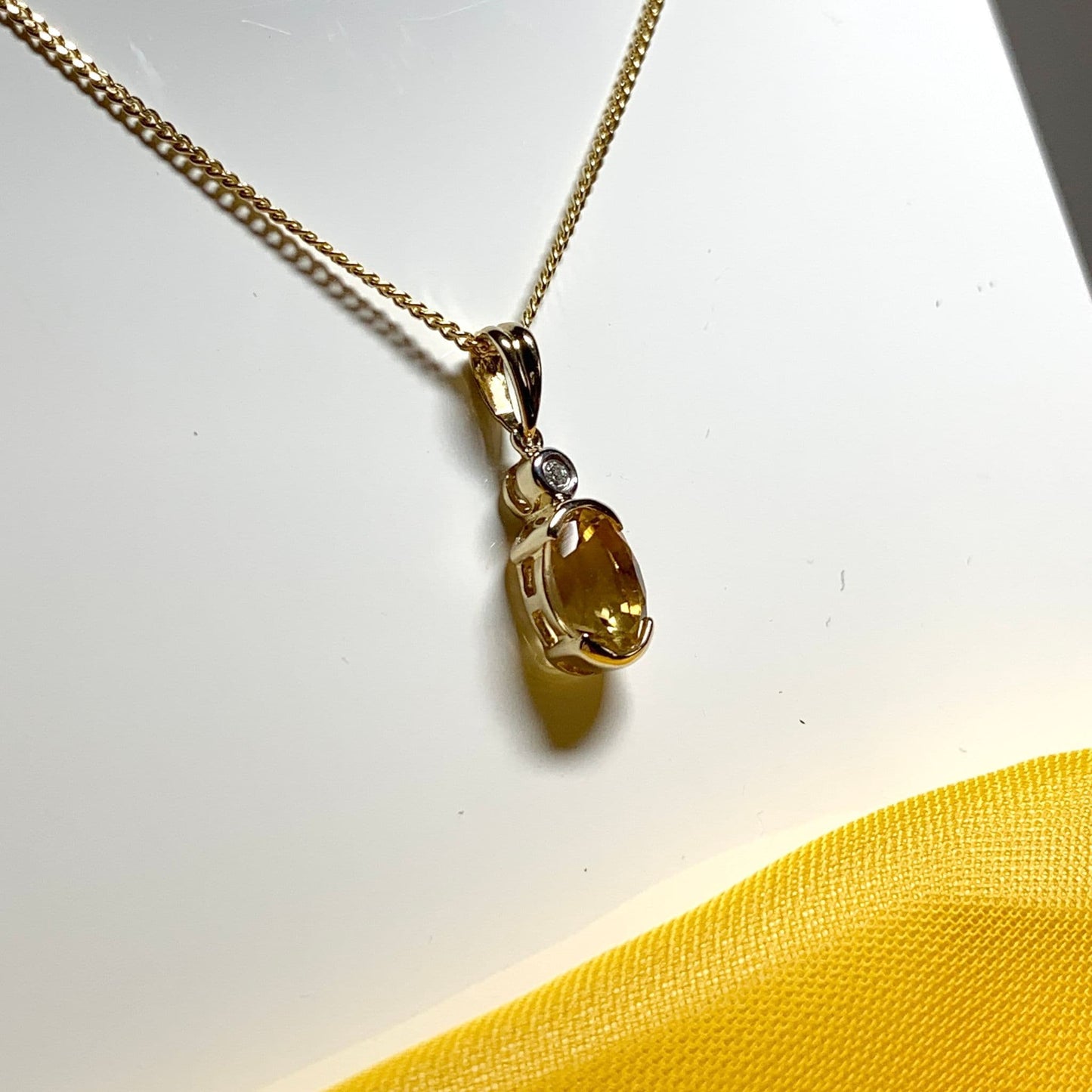 Oval yellow citrine and diamond gold necklace