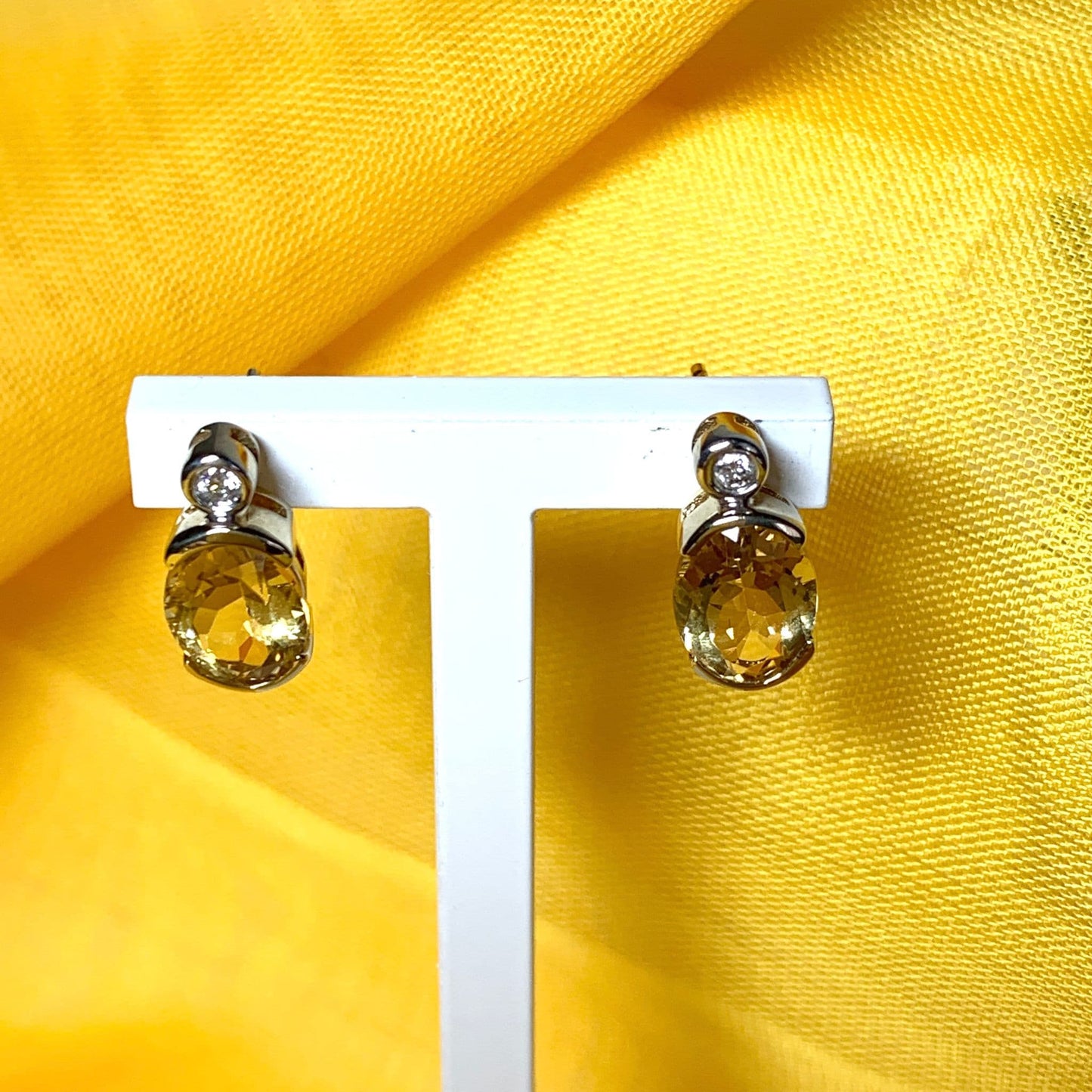 Oval yellow citrine and diamond gold stud earrings