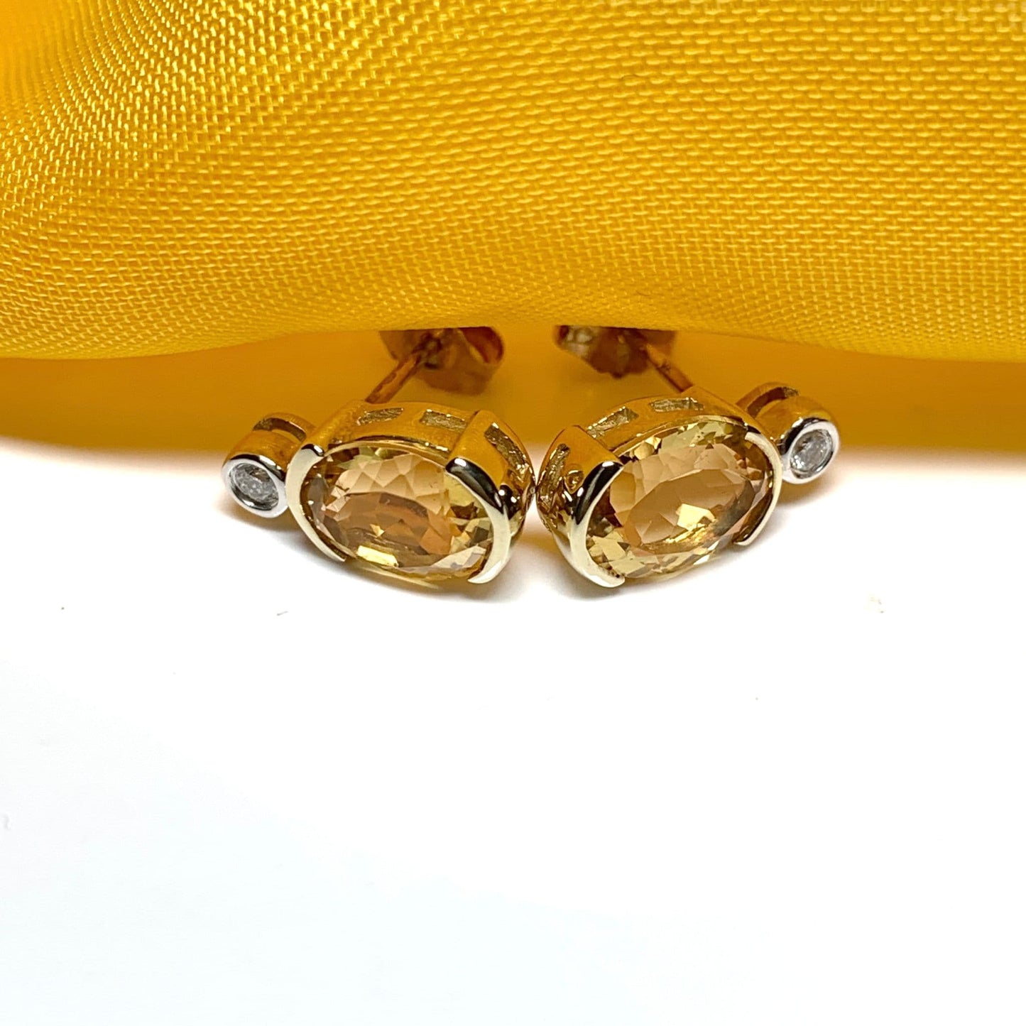 Oval yellow citrine and diamond gold stud earrings