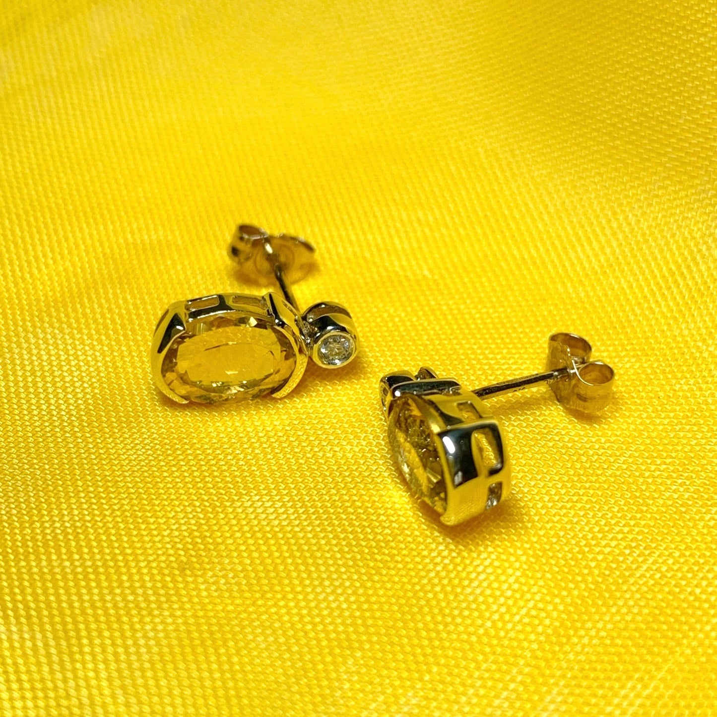 Oval yellow citrine and diamond gold stud earrings