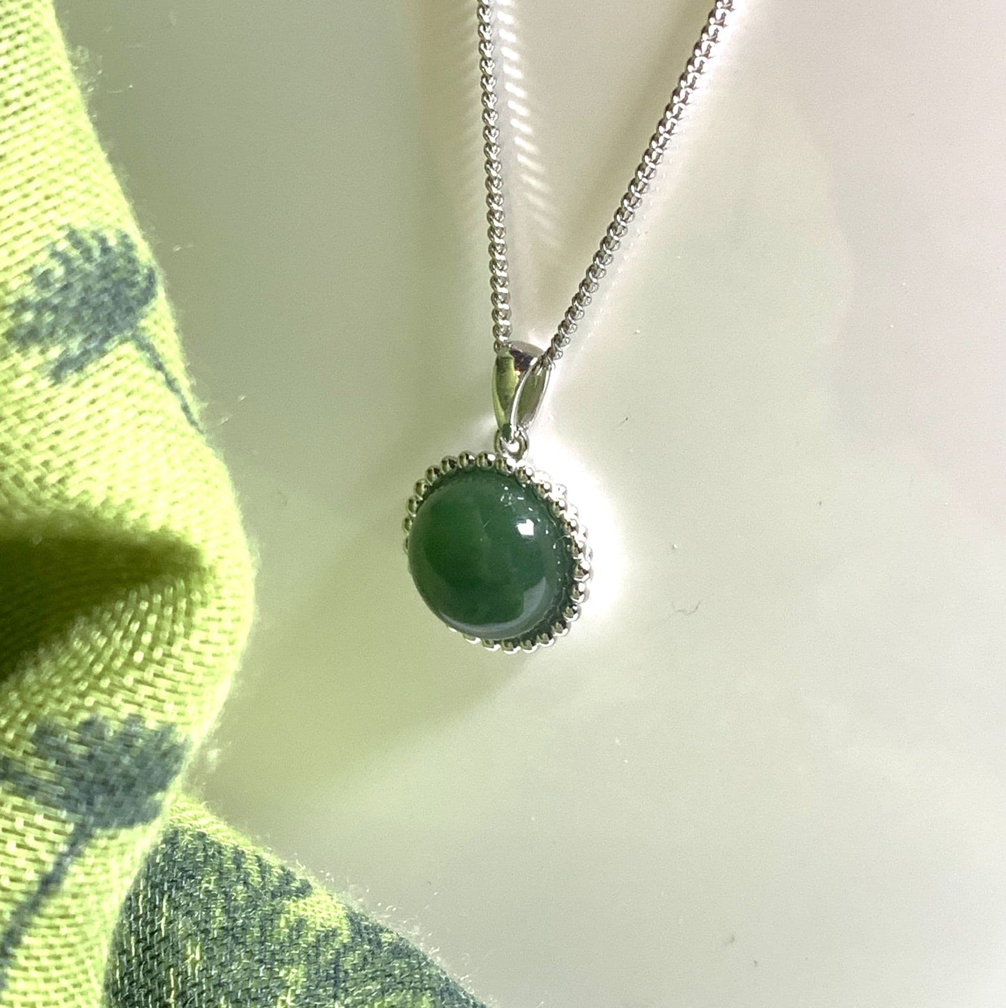 Round green jade patterned bobbled necklace sterling silver pendant