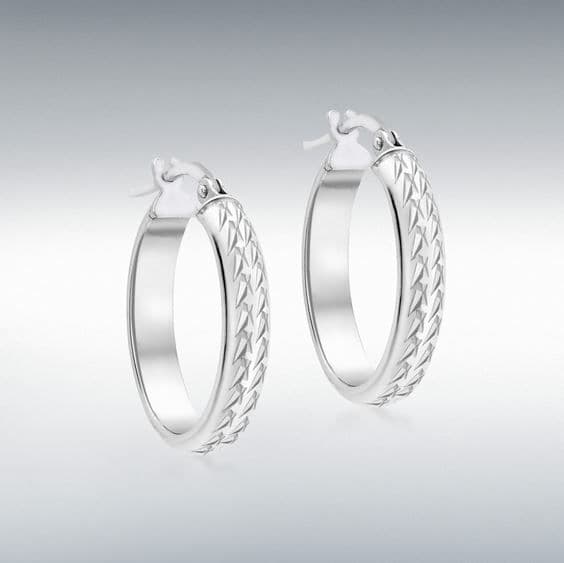 White gold patterned oval hoop earrings diamond cut