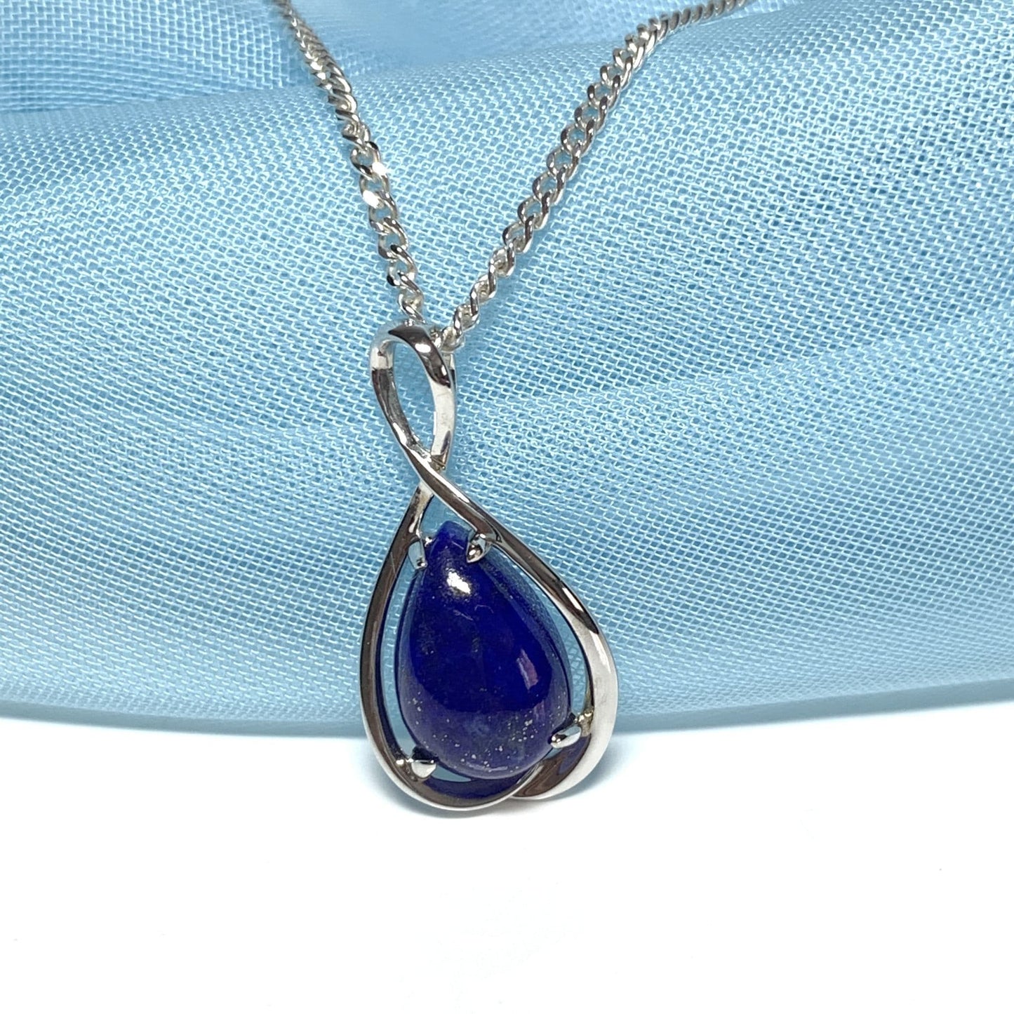 White gold pear teardrop shaped blue lapis lazuli necklace pendant