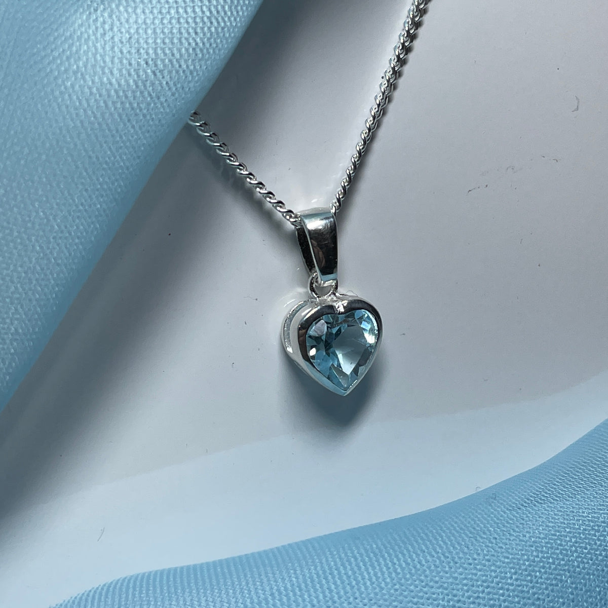 Heart shaped blue topaz sterling silver necklace pendant