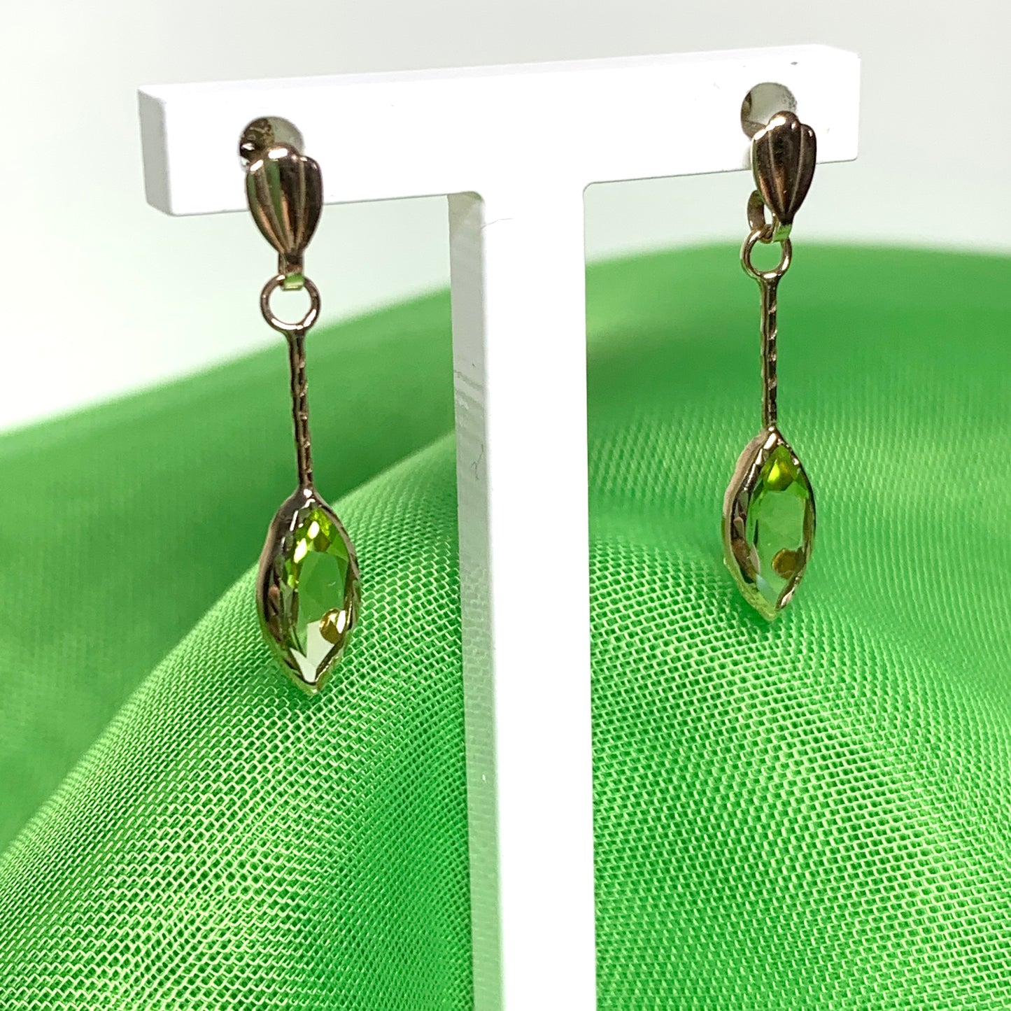 Marquise shaped peridot yellow gold drop earrings