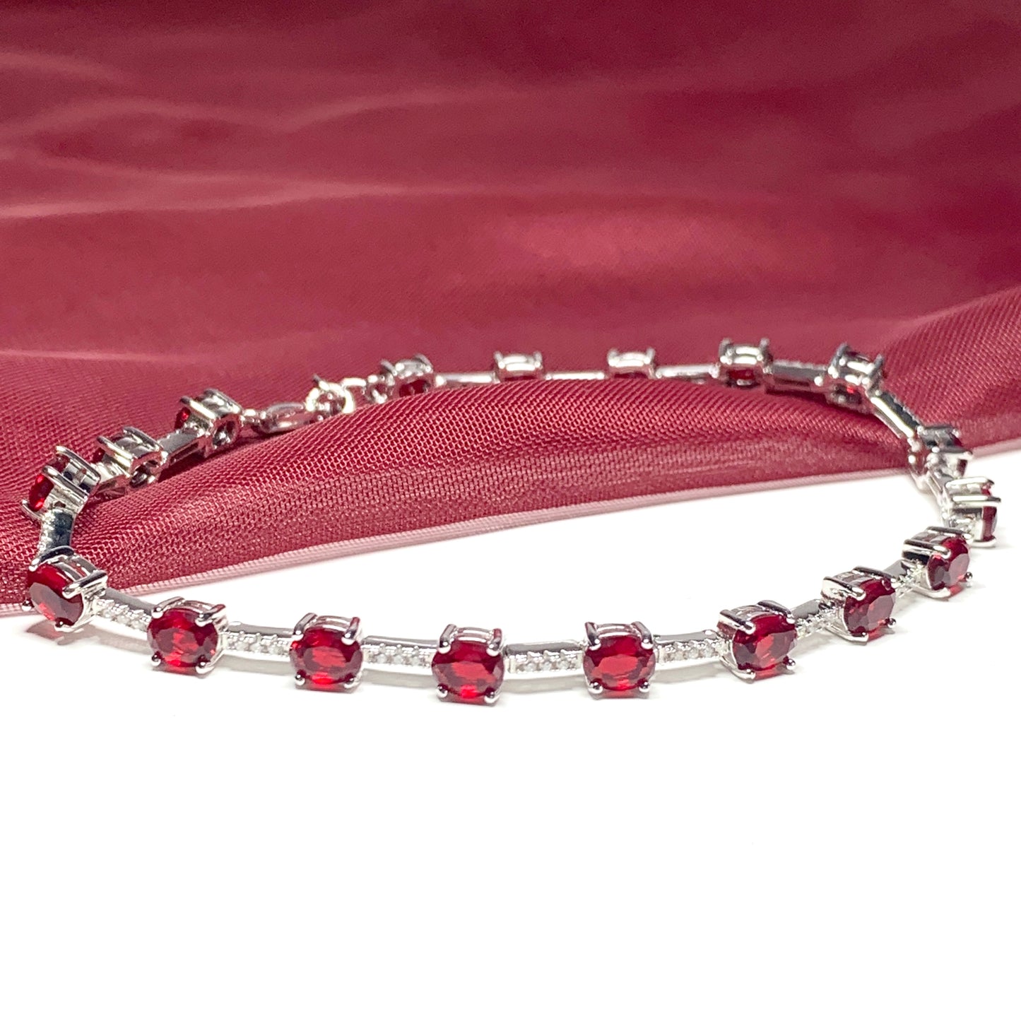 Oval sterling silver red cubic zirconia bracelet