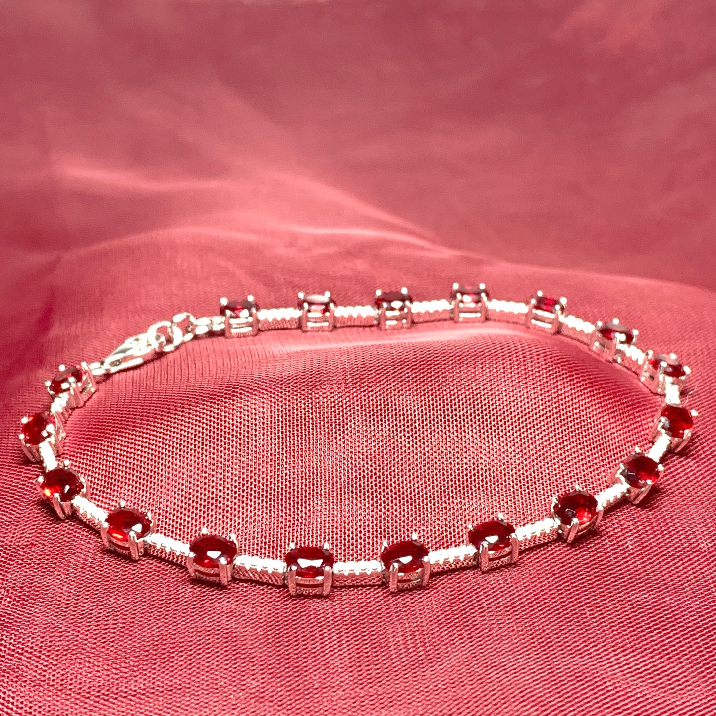 Oval sterling silver red cubic zirconia bracelet