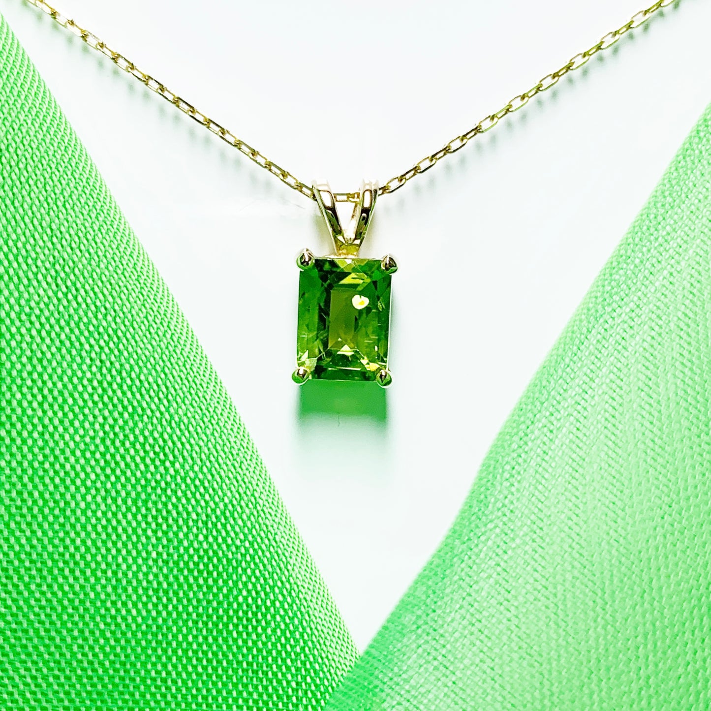 Peridot yellow gold claw set rectangle necklace