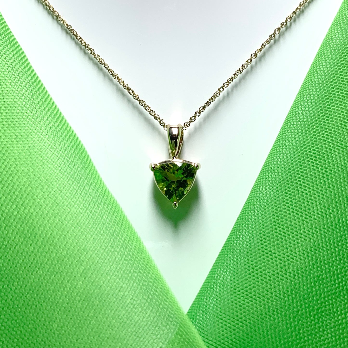 Peridot yellow gold trillion cut necklace