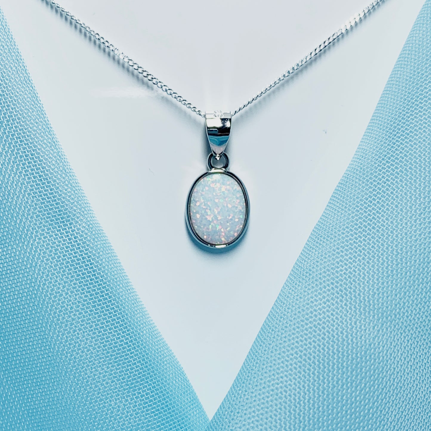Sterling silver oval opal rubbed over necklace