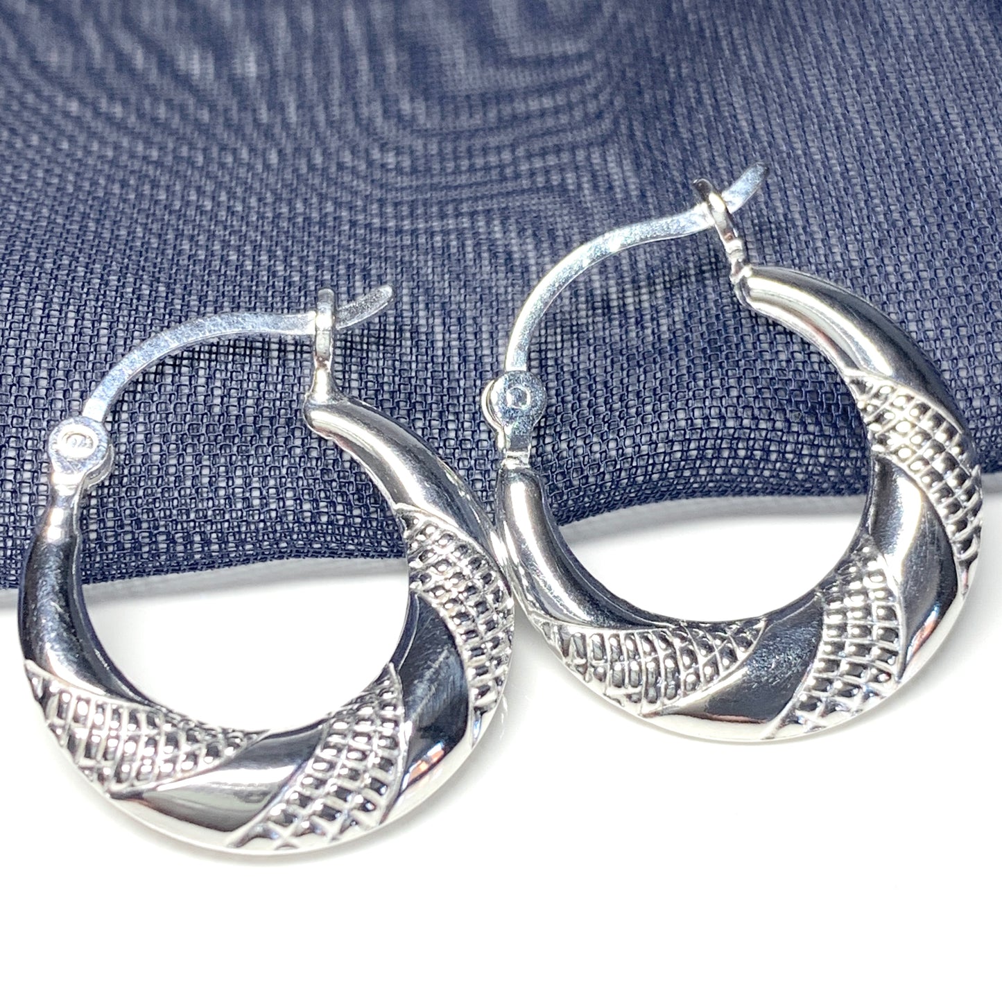 Sterling silver patterned round creole earrings