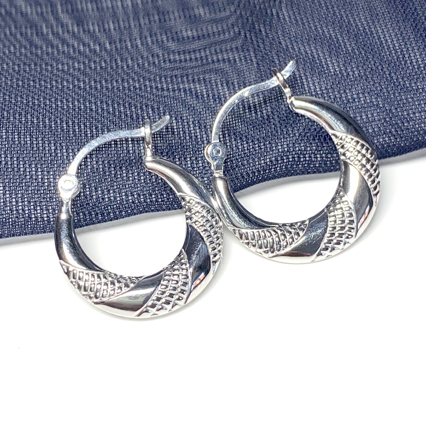 Sterling silver patterned round creole earrings