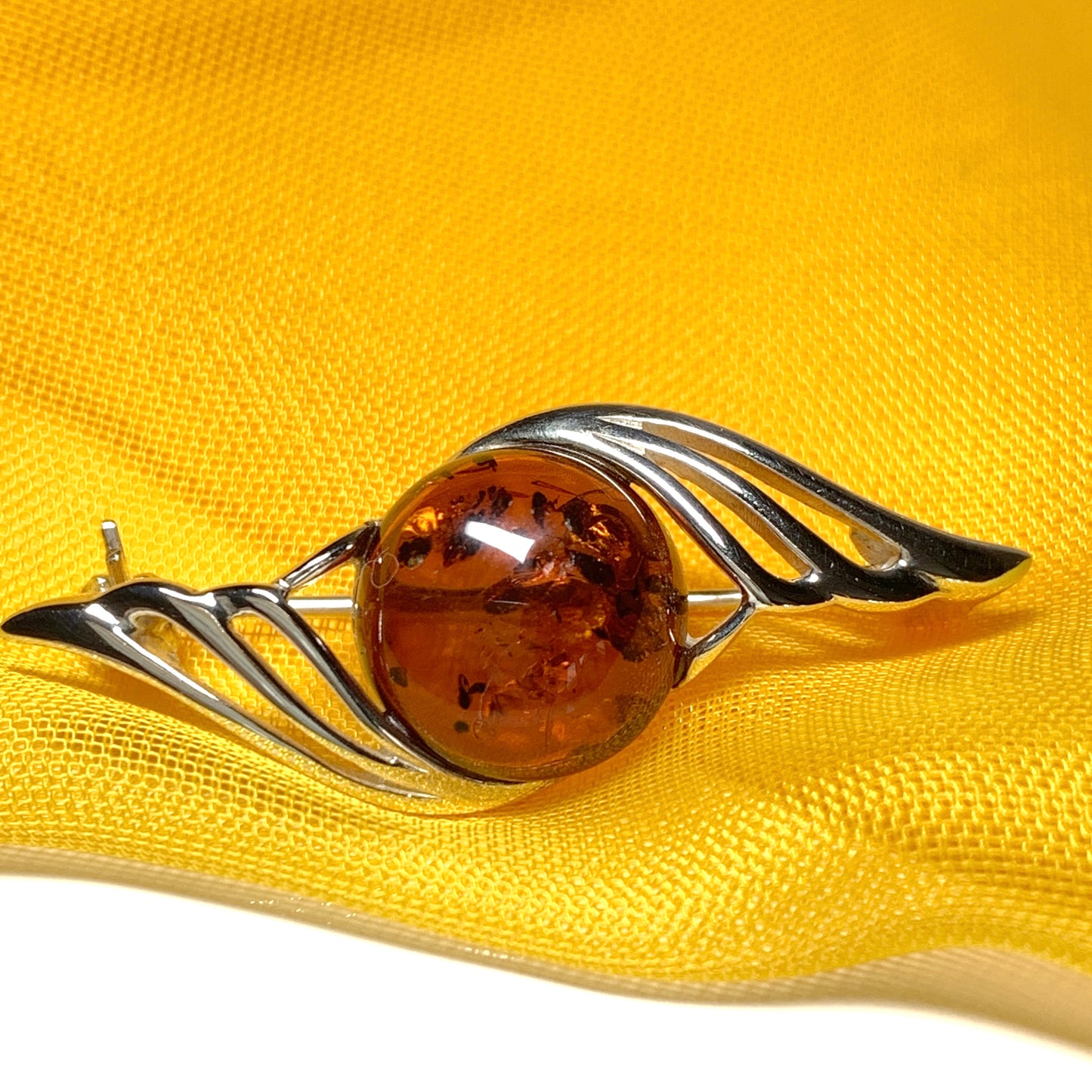 Sterling silver swirl fancy amber brooch