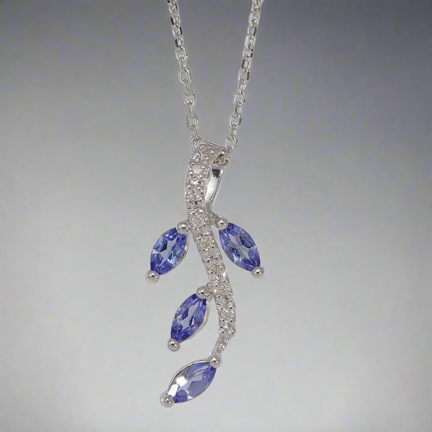 Tanzanite and diamond white Gold fancy spray necklace