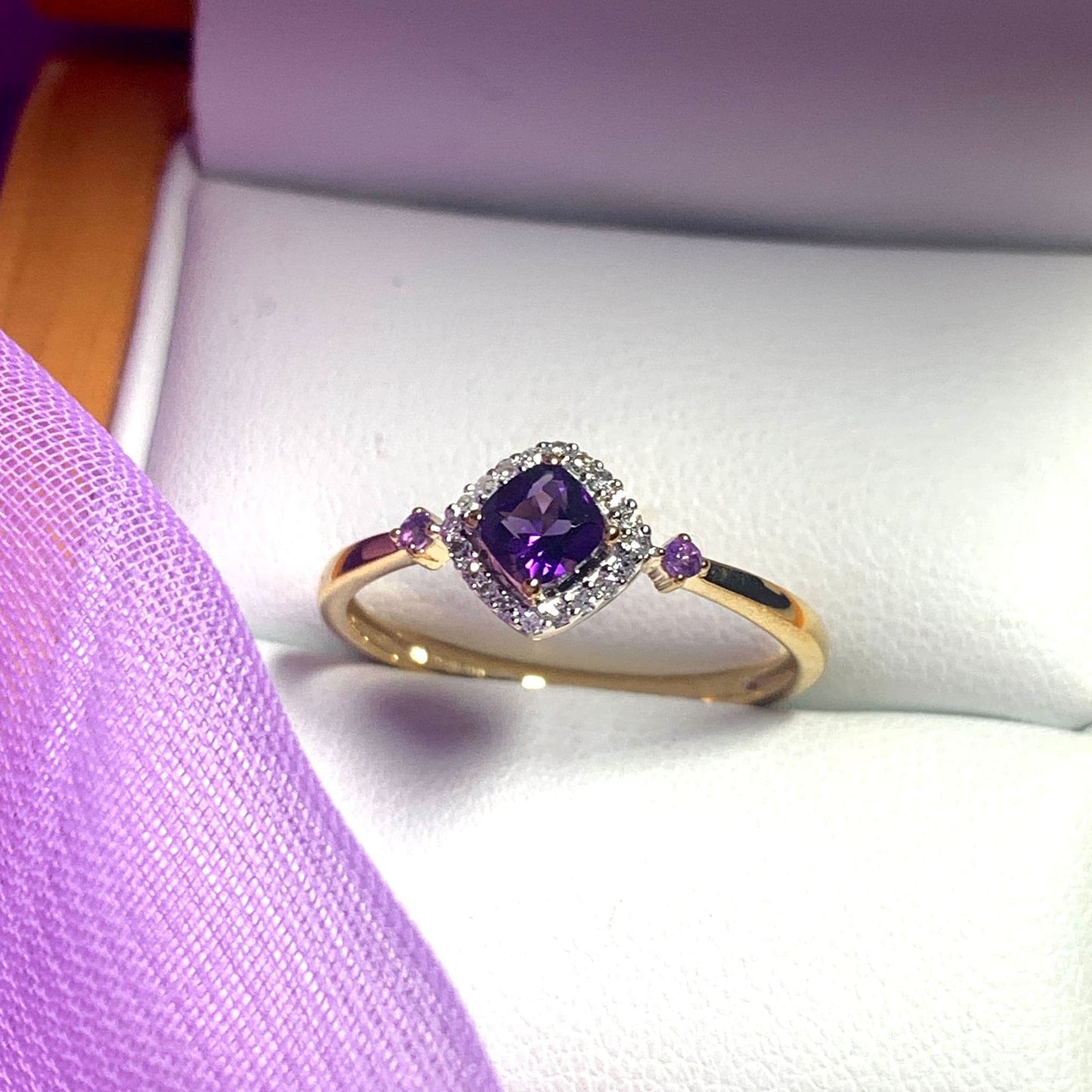 Amethyst and diamond yellow gold cluster ring