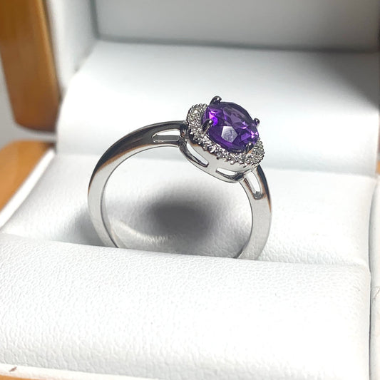 Oval cut amethyst and diamond white gold cluster ring