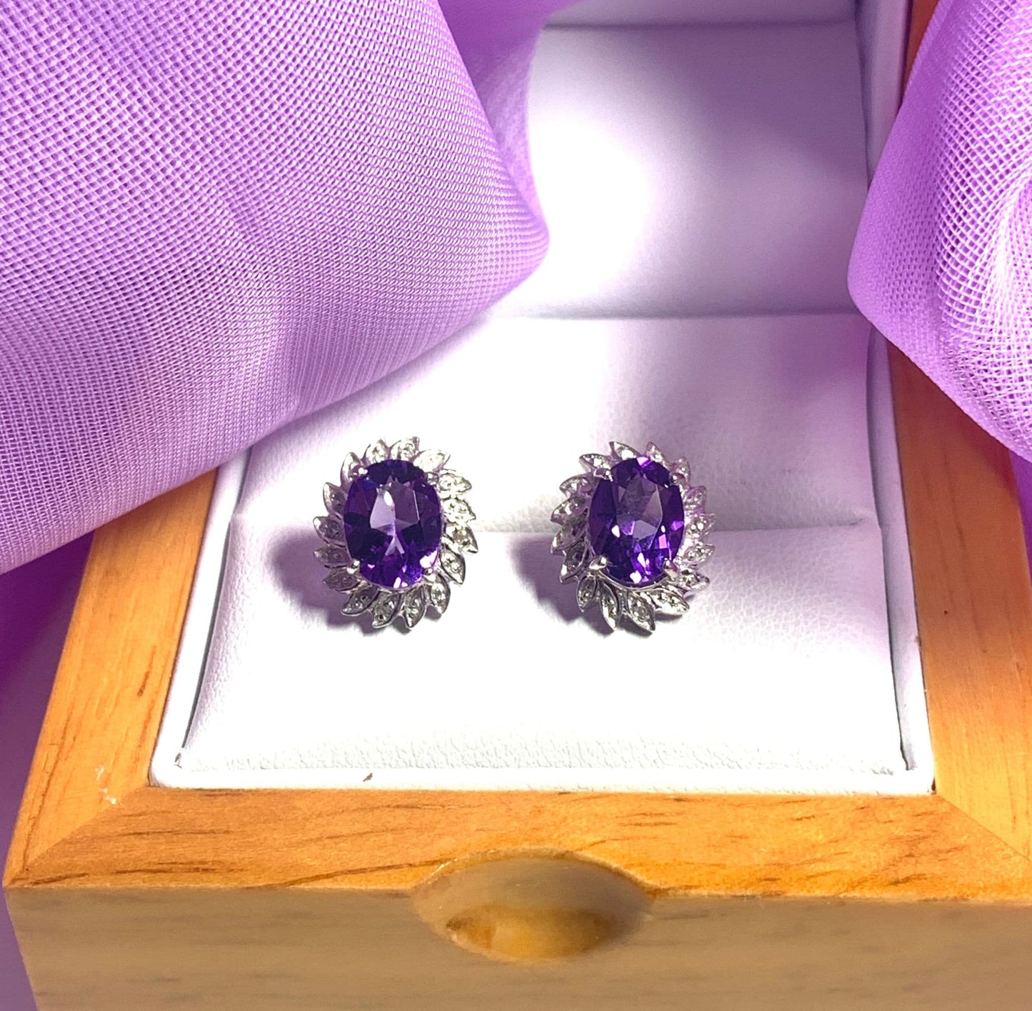 Oval shaped purple amethyst and diamond sterling silver cluster stud earrings
