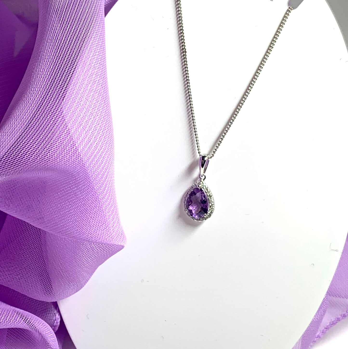 Pear shaped purple amethyst and diamond white gold necklace pendant