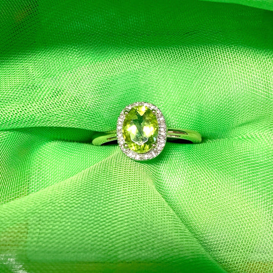 Peridot and diamond yellow gold oval cluster ring